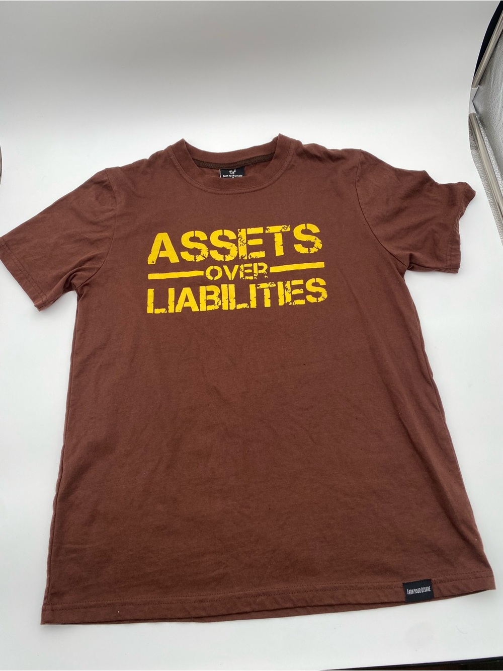 Assets Over Liabilities Brown Graphic Tee